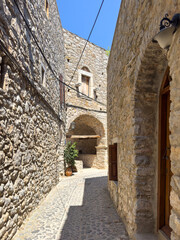 Narrow medieval alley in Mesta Village. Chios Island, Greece.