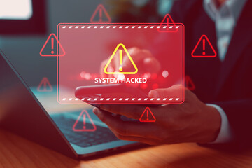 Cybersecurity breach concept showing a hacker attack alert on a mobile device with red warning...