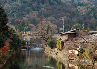 Arashiyama is a district on the western outskirts of Kyoto, Japan. It also refers to the mountain across the oei River, which forms a backdrop to the district. 