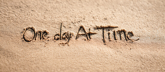 One Day at a Time Handwritten in Wet Beach Sand with Minimalist One-Line Calendar – Wide Banner Layout for Motivational and Mindfulness Campaigns