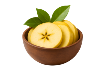 Sliced yellow apples in a wooden bowl with green leaves