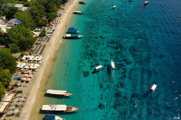 Aerial views of Gili T captured in May 2025. Crystal-clear waters, coral reefs, and tropical coastline from above — showcasing the island’s serene beauty and vibrant marine life.