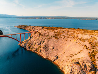 Maslenica Bridge spanning the Novsko zdrilo strait on Croatia’s Adriatic coast. Red steel...