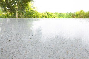 Outdoor terrazzo floor and natural view. Look clean, white bright surface. Finishing material made of marble chips and white cement. Graphic resource element for backgrounds.