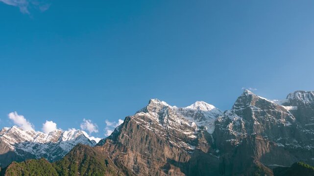 4K Zoom in Time lapse of sunset in Himalaya mountains at Lahaul, Himachal Pradesh, India. Sunlight and shadow moving on mountain peaks during sunset. Day to night timelapse. Nature background. 