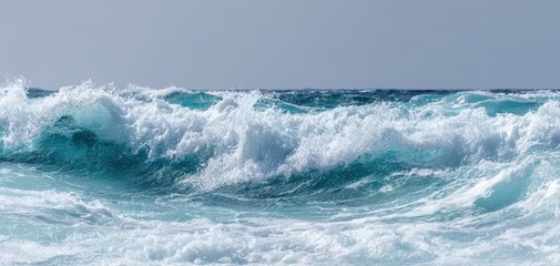 Fototapeta premium The Majestic Ocean Waves Dancing Under the Clear Blue Sky