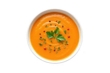 Bowl of creamy tomato soup with parsley isolated on transparent background