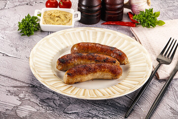 Delicous natural roasted sausages in the plate