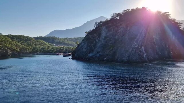 Wonderful Paradise bay of Camyuva, Kemer, Turkey. Scenery sea view to the coast with boats on the blue water. Summertime holiday seascape