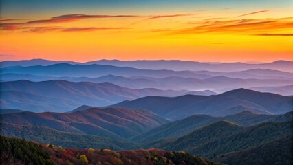 Vibrant sunset over layered mountain ranges