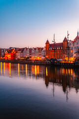 Fototapeta premium Gdansk with Motlawa river in Poland. Old town colourful house with Stragania Gate