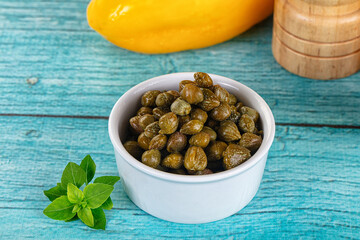 Pickled canned capers in the bowl