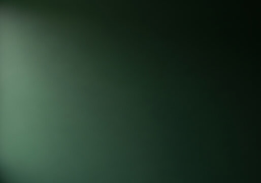Abstract backdrop of a dark green painted wall, featuring a smooth texture illuminated by soft natural lighting for a minimal design