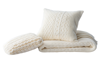 Cozy cream textured pillow and matching knitted blankets displayed on black background