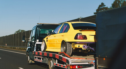 Naklejka premium Breakdown recovery service transporting car