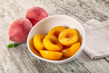 Sweet ripe yellow canned peaches