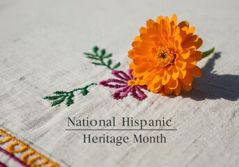 Orange marigold flower on embroidered cloth celebrating Hispanic Heritage Month