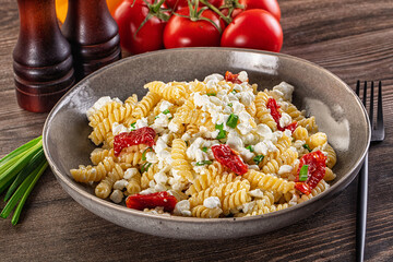 Italian pasta fusili with curd