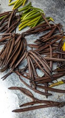 Fresh dried vanilla bean pods displayed on a local market stall in Bali Indonesia