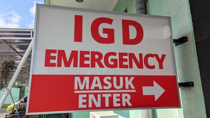 Closeup of sign for IGD Instalasi Gawat Darurat in dual Indonesian Bahasa and English language for emergency department ward at hospital in Bali Indonesia