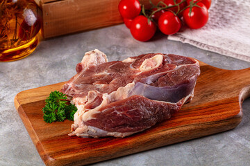 Raw lamb steak with bone