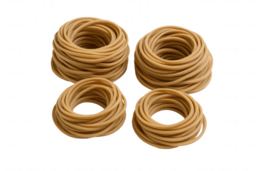 Four stacks of tan rubber bands, neatly coiled and presented against a dark backdrop, showcasing their elastic properties and utility.