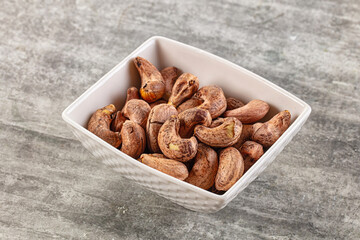 Unpeeled cashew nuts in the bowl