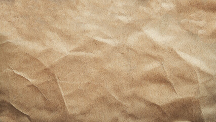 Brown paper texture background. Beige kraft paper texture. Close-up view of a crumpled brown paper texture, ideal for various design projects, backgrounds, or crafts needing an organic and textured 