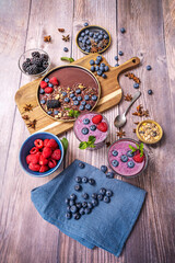 Autumn table setting with cranberries, walnuts, and a hot berry juice for relaxing moments