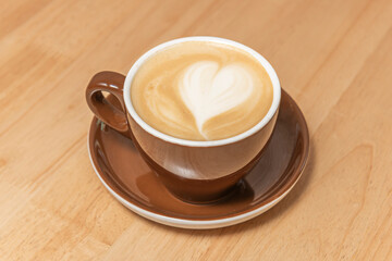 Artistic composition in coffee foam where a heart emerges, masterfully created by a barista