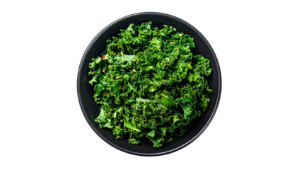 Freshly shredded green vegetables in a black bowl, showcasing vibrant color and texture isolated on solid white background