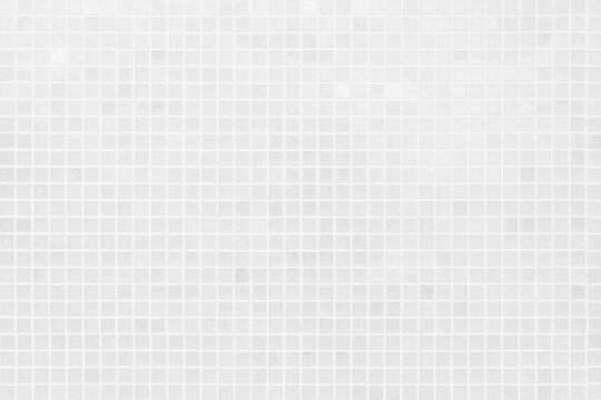White tile checkered background bathroom floor texture. Ceramic wall and floor tiles mosaic background in bathroom.
