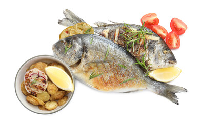 Tasty roasted dorado fish with spices, potatoes and tomato isolated on white, top view. Homemade seafood dish