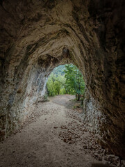 Obraz premium Inside view of Suba-lyuk Cave opening to forest