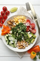 Different healthy vegetarian food served on white wooden table, flat lay