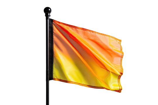 A vibrant orange and yellow flag billows on a dark pole