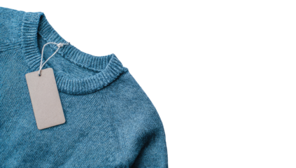 Close-up of a light teal-blue knitted sweater with a blank price tag attached to the neckline.  The sweater's texture is visible, and the tag is a simple rectangle of light beige
