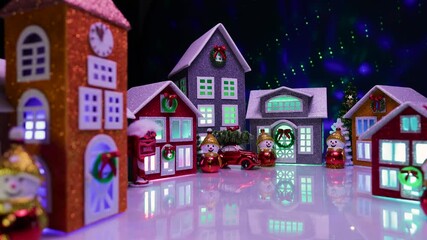 Beautiful large festive Christmas village with colorful lights and colorful houses