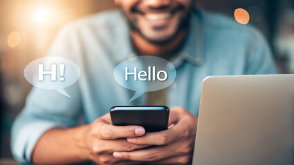 Businessman in an office using a laptop and a tablet with a smartphone on the desk