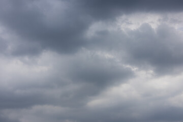 overcast sky filled with dark and light gray clouds, conveying a sense of moodiness