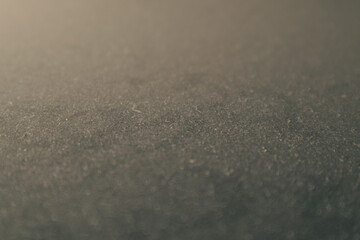 White micro dust on black background. Texture grunge background with tiny white dust. Home cleaning concept.