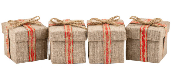 Four small, light beige gift boxes with red striped ribbon and twine