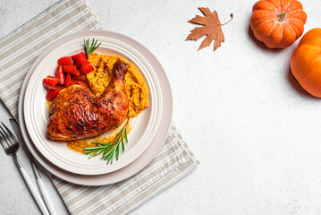 Autumn meal: roasted chicken quarter with mashed sweet potato