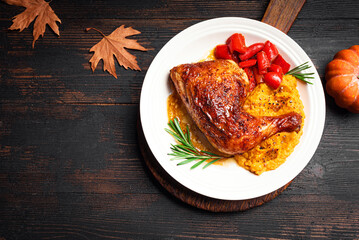 Autumn food: oven-baked chicken quarter with mashed sweet potato