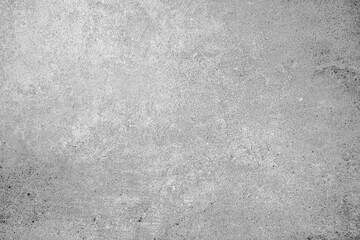Light gray concrete wall surface with subtle scratches and textured background