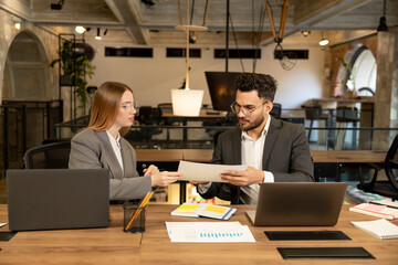 Male and female managers working together in the office