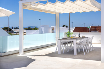 Spacious Rooftop Terrace with Shade and Dining Area