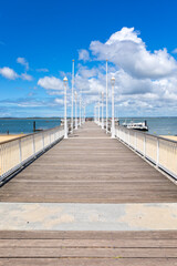 The pier of french seaside resort Arcachon crossing the city's beach. 