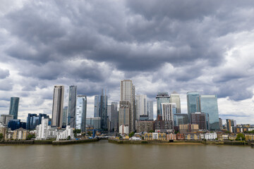 Fototapeta premium Drone image of Canary Wharf Skyline under a stormy sky from across the Thames.