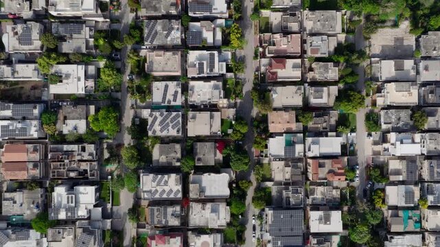 Aerial View of Residential Area in Pakistan, Highlighting Solar Panels and Green Spaces